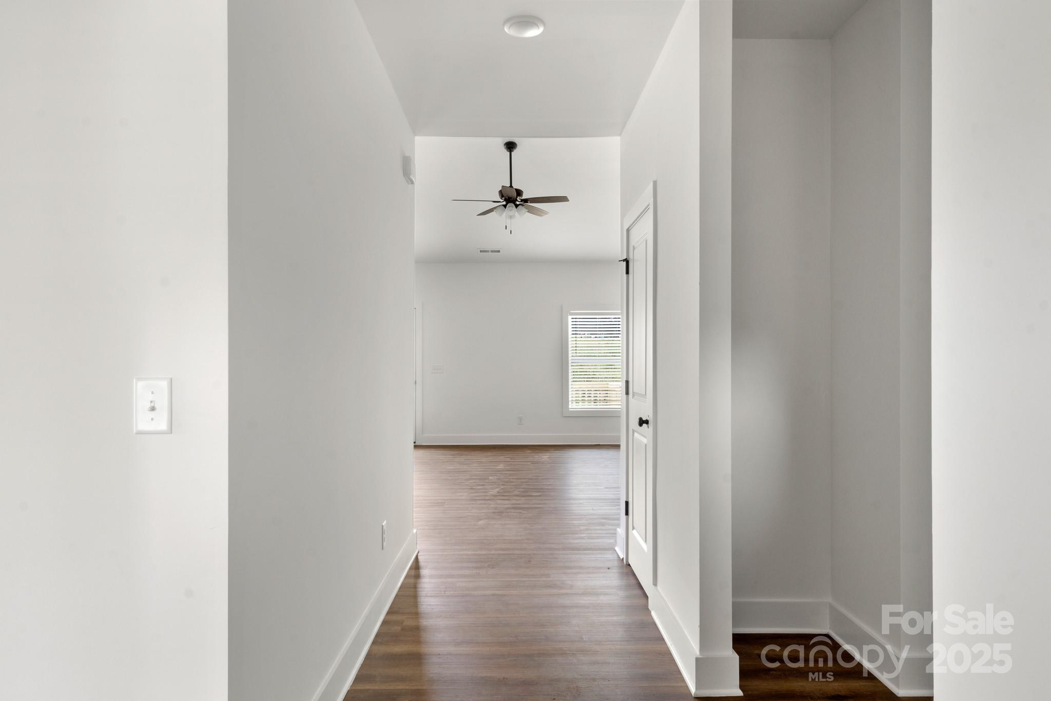 2508 Rock Dam Road Harmony, NC 28634 - Photo 14 of 32 a view of a hallway with wooden floor