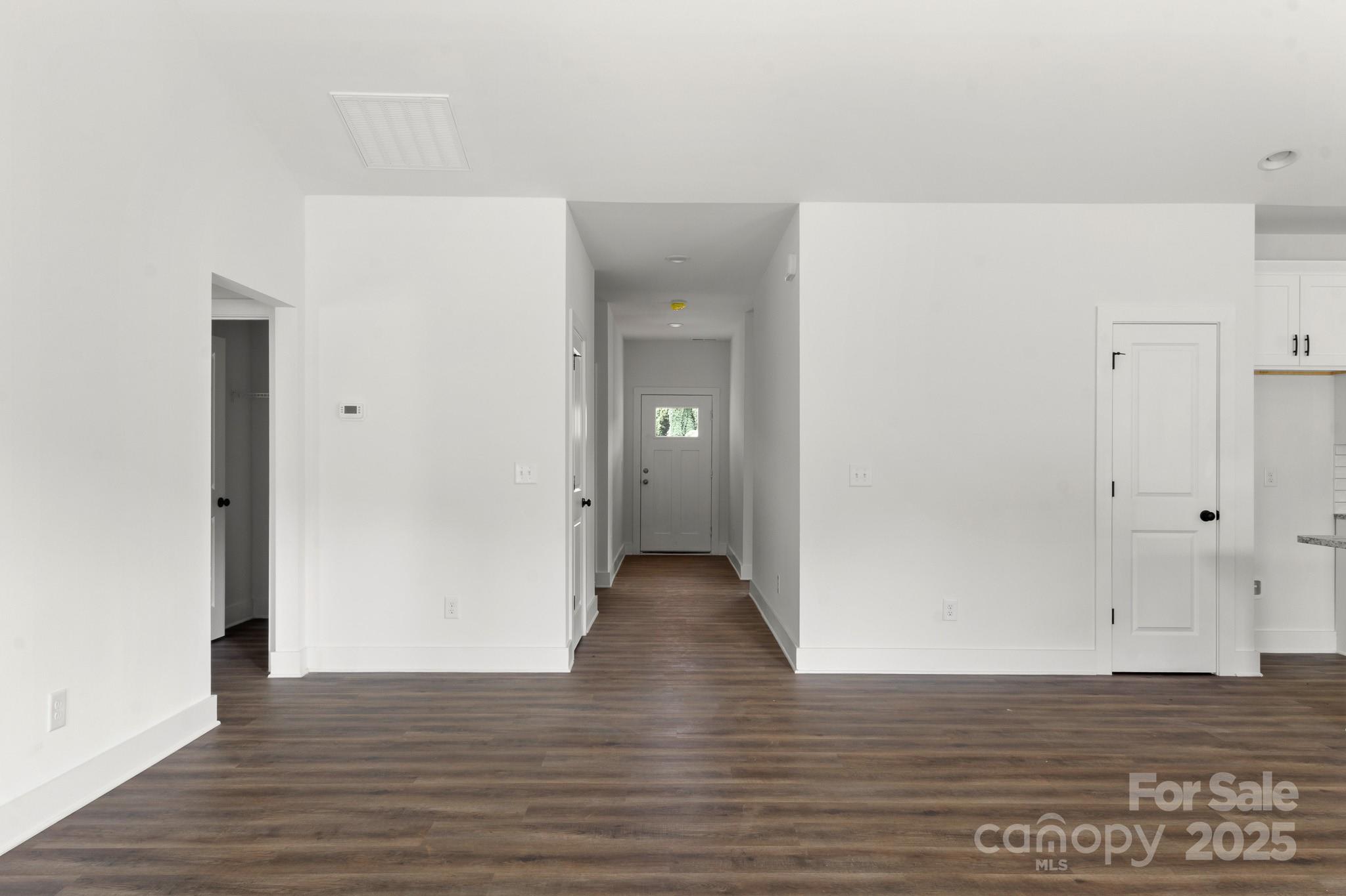 2508 Rock Dam Road Harmony, NC 28634 - Photo 20 of 32 a view of an empty room with wooden floor
