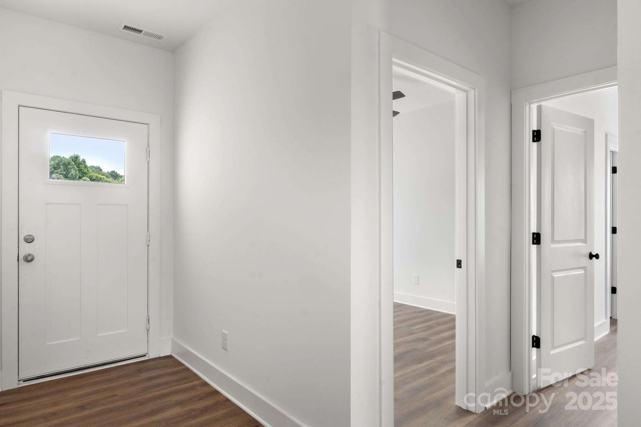 2508 Rock Dam Road Harmony, NC 28634 - Photo 21 of 32 a view of a hallway with wooden floor