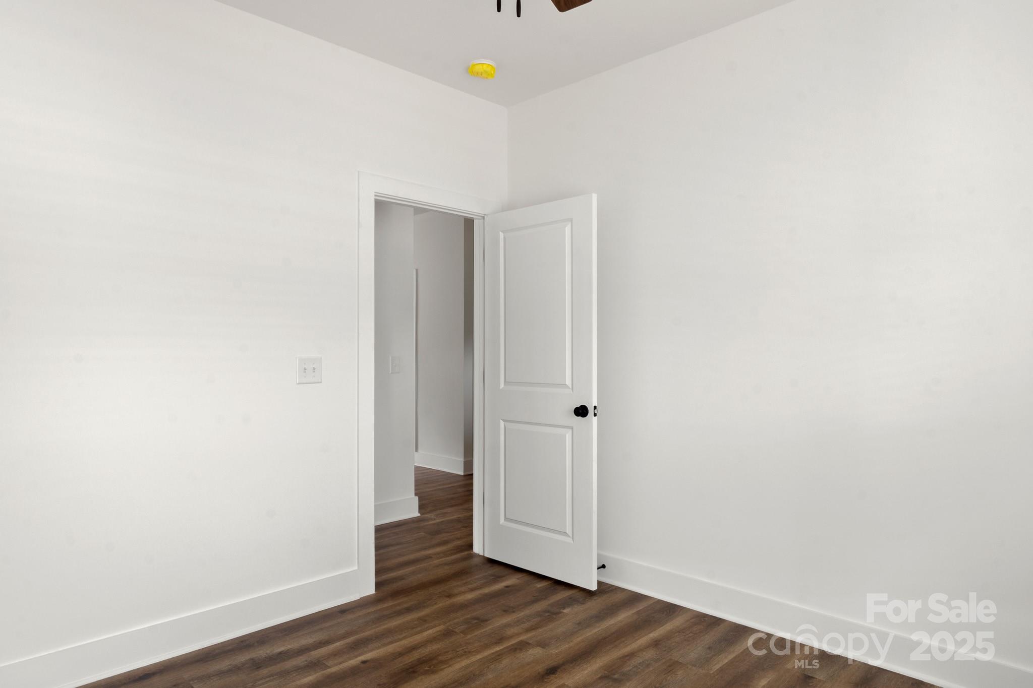 2508 Rock Dam Road Harmony, NC 28634 - Photo 26 of 32 a view of an empty room with wooden floor