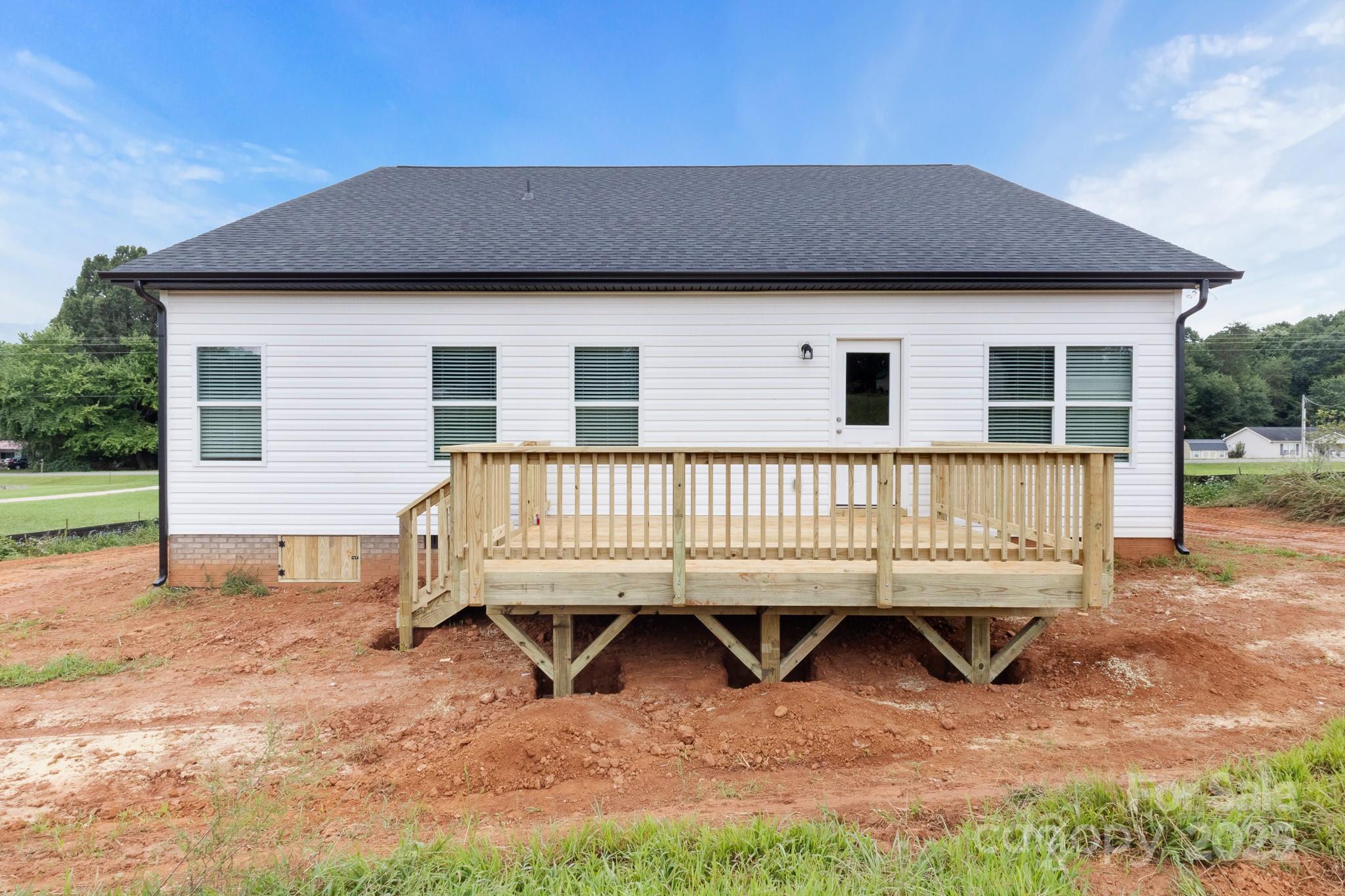 2508 Rock Dam Road Harmony, NC 28634 - Photo 30 of 32 a view of a house with a yard and sitting area