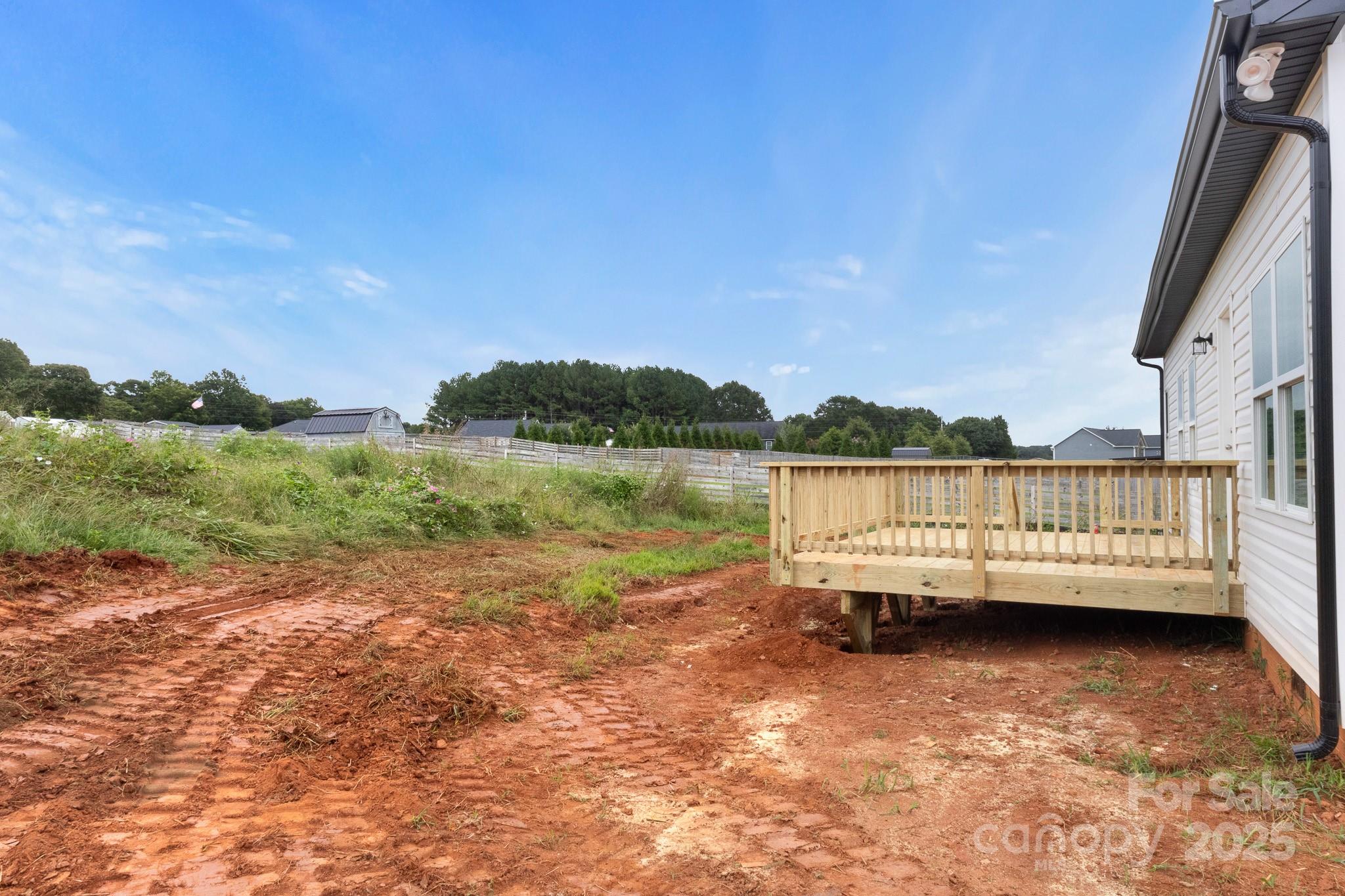 2508 Rock Dam Road Harmony, NC 28634 - Photo 31 of 32 a view of a lake with houses in the background