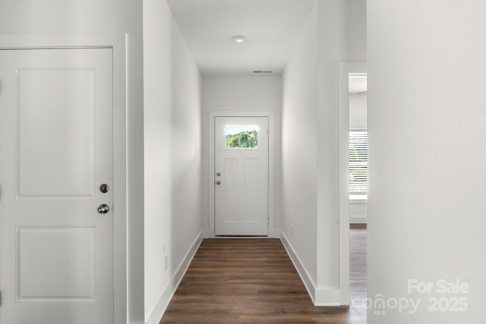 2508 Rock Dam Road Harmony, NC 28634 - Photo 4 of 32 a view of a hallway with wooden floor