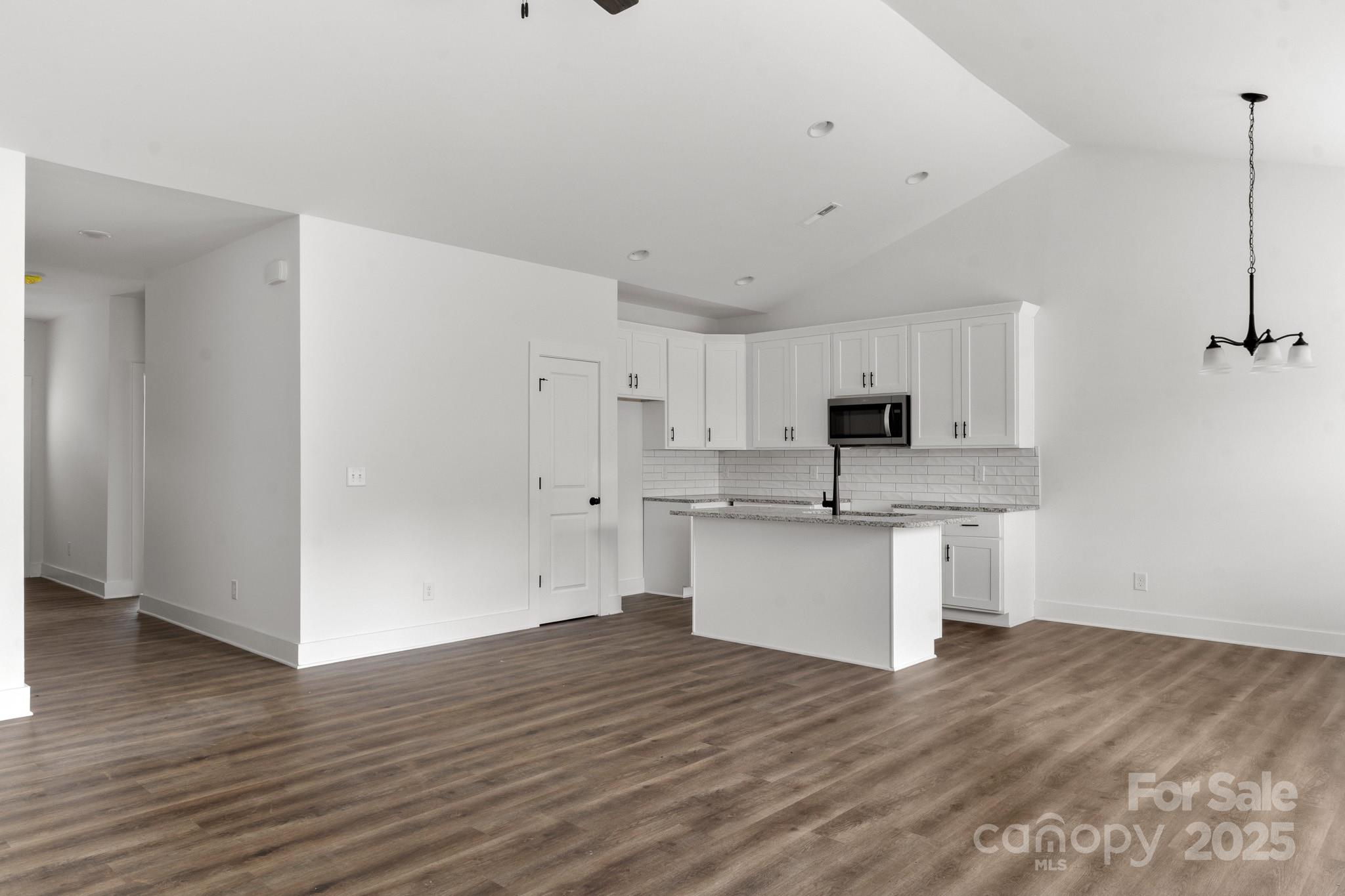 2508 Rock Dam Road Harmony, NC 28634 - Photo 7 of 32 a view of a kitchen with wooden floor