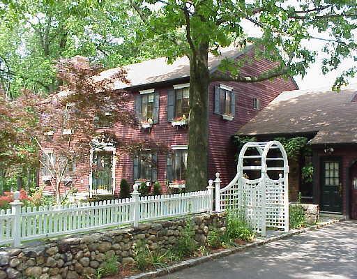 25 Mayapple Road Stamford, CT 06903 - Photo 1 of 1 a front view of a house with a garden