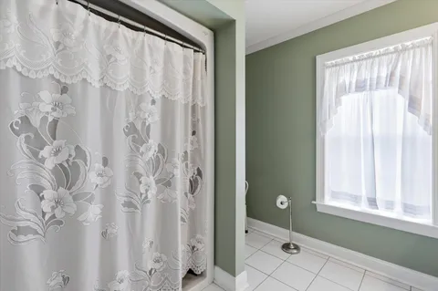 a bathroom with a shower and a sink
