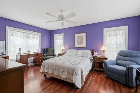 a bedroom with a bed and a couch