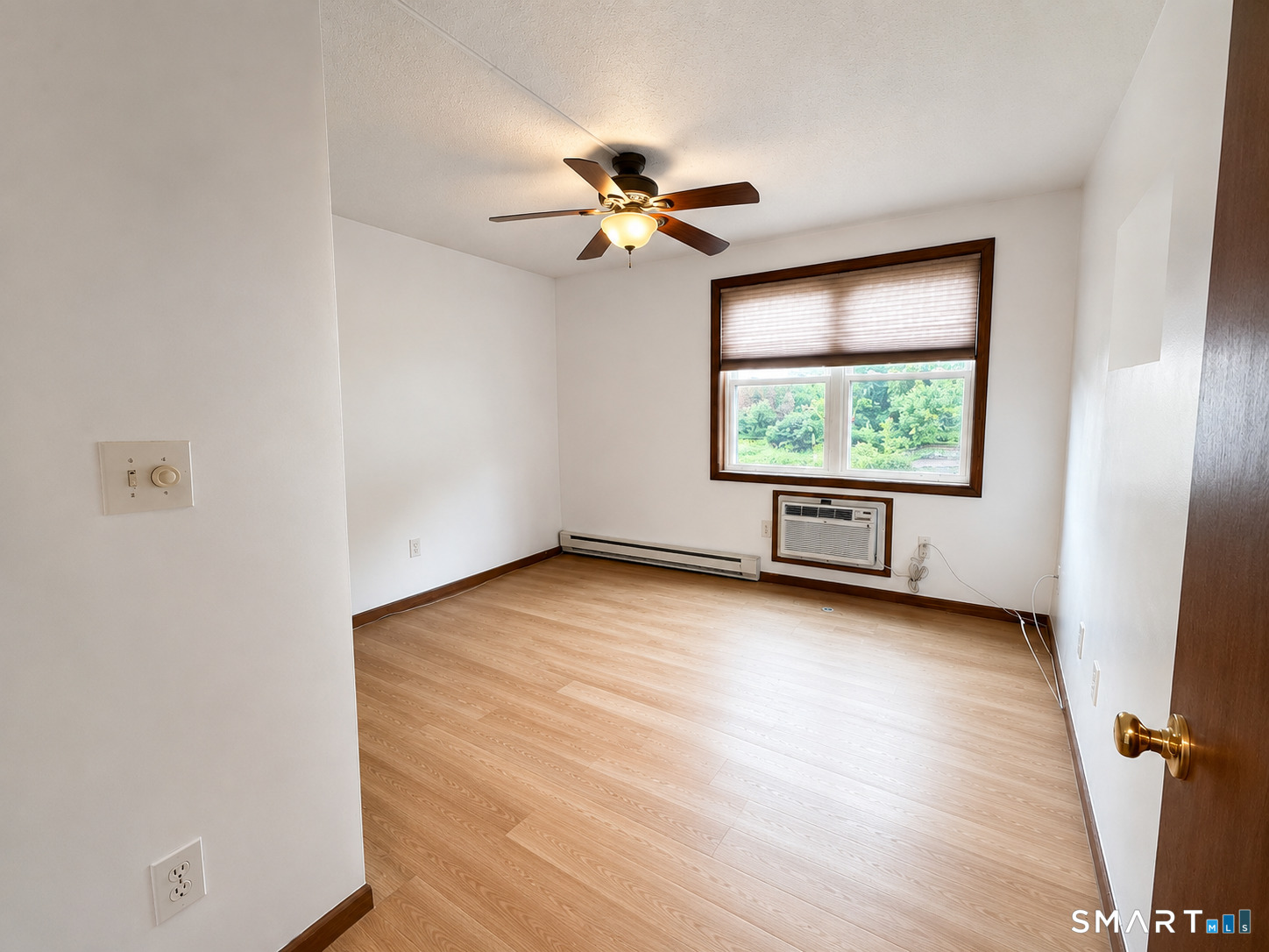 1001 Old Colony Road, Unit 72 Meriden, CT 06451 - Photo 5 of 7 wooden floor in an empty room with a window