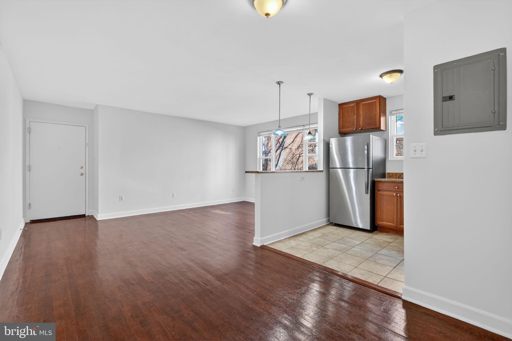 2523 13th Street Northwest, Unit 305 Washington, DC 20009 - Photo 14 of 25 a view of a kitchen with wooden floor
