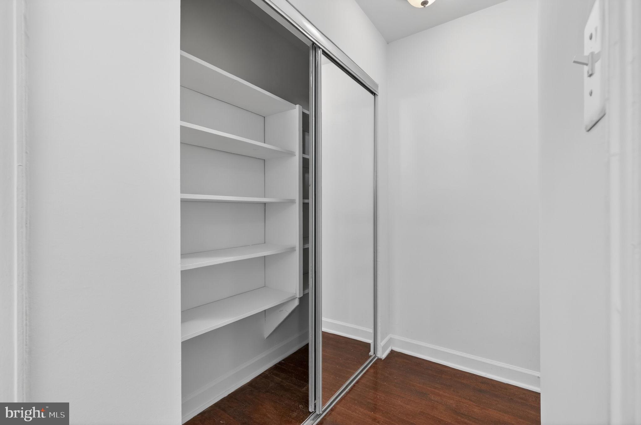 2523 13th Street Northwest, Unit 305 Washington, DC 20009 - Photo 15 of 25 a view of walk in closet with empty racks