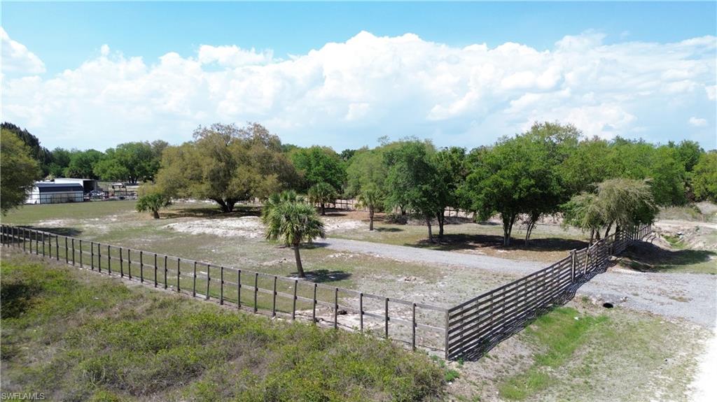 180 North Datil Street Clewiston, FL 33440 - Photo 11 of 11 a view of a street with houses in the background