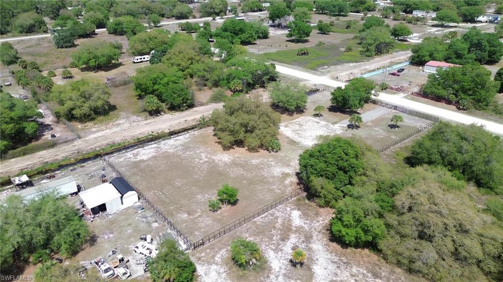 180 North Datil Street Clewiston, FL 33440 - Photo 4 of 11 an aerial view of a house with a yard