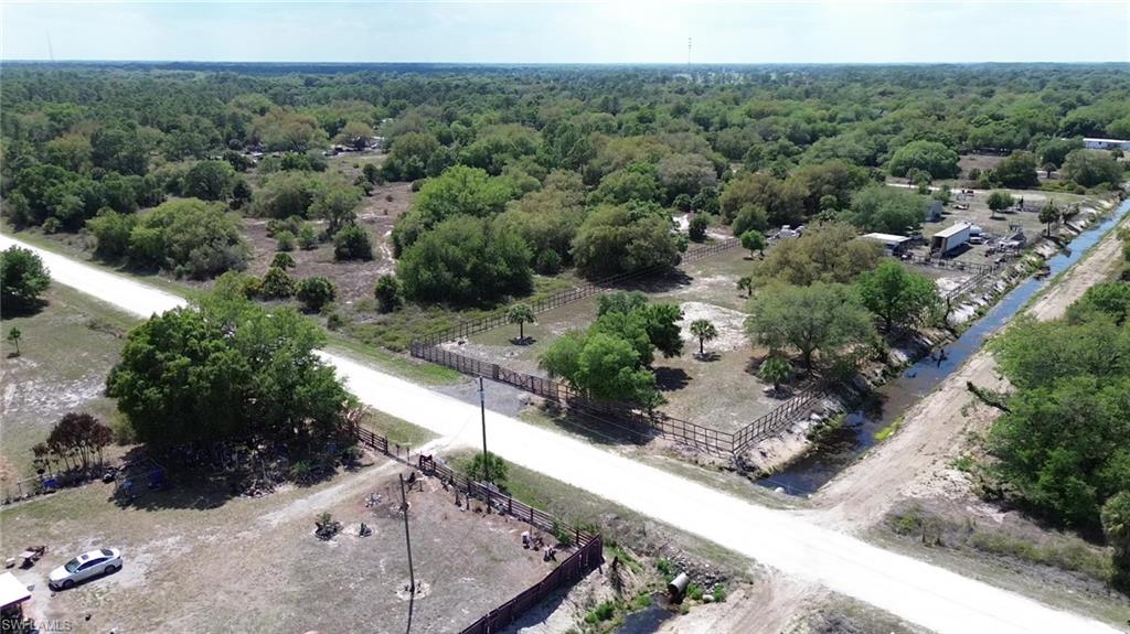 180 North Datil Street Clewiston, FL 33440 - Photo 8 of 11 an aerial view of a house with a yard
