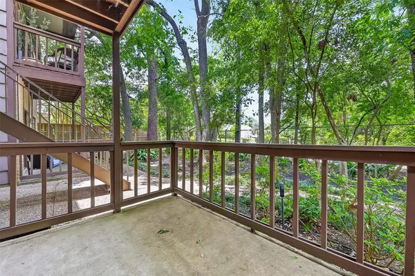 a view of a balcony with an outdoor space