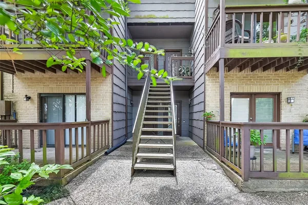 a view of stairs and yard