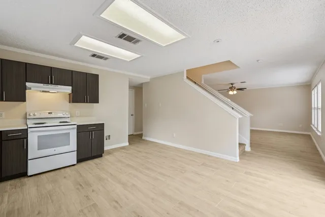 a kitchen with a stove and a refrigerator