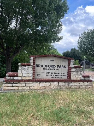 a view of outdoor space with playground and green space