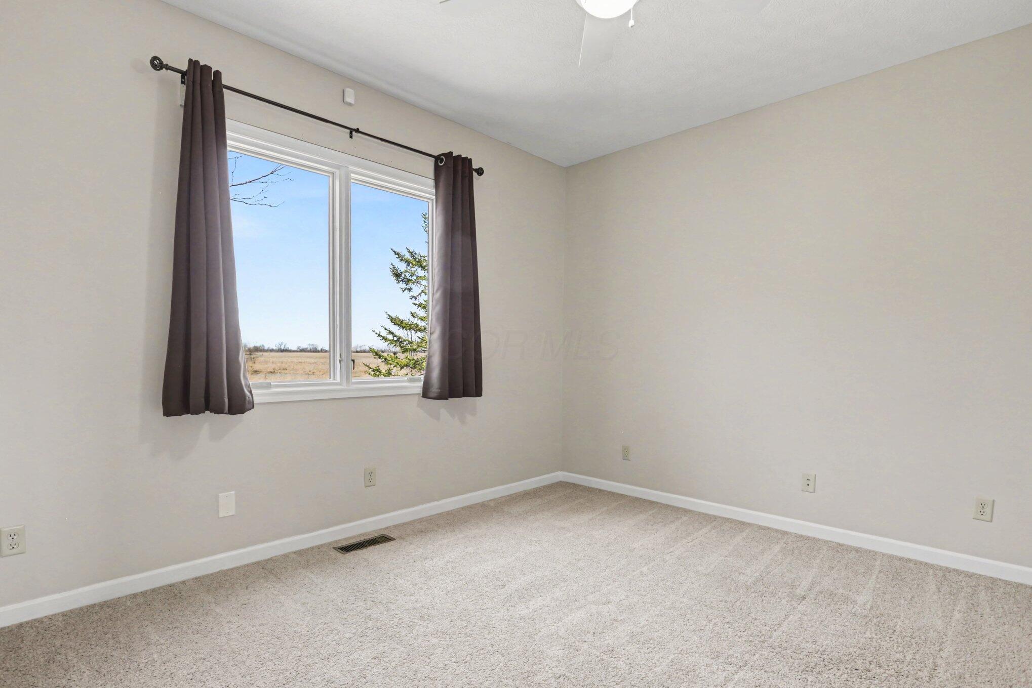 1855 Spring Valley Road London, OH 43140 - Photo 24 of 54 Spacious with lots of natural light, ceiling fan.