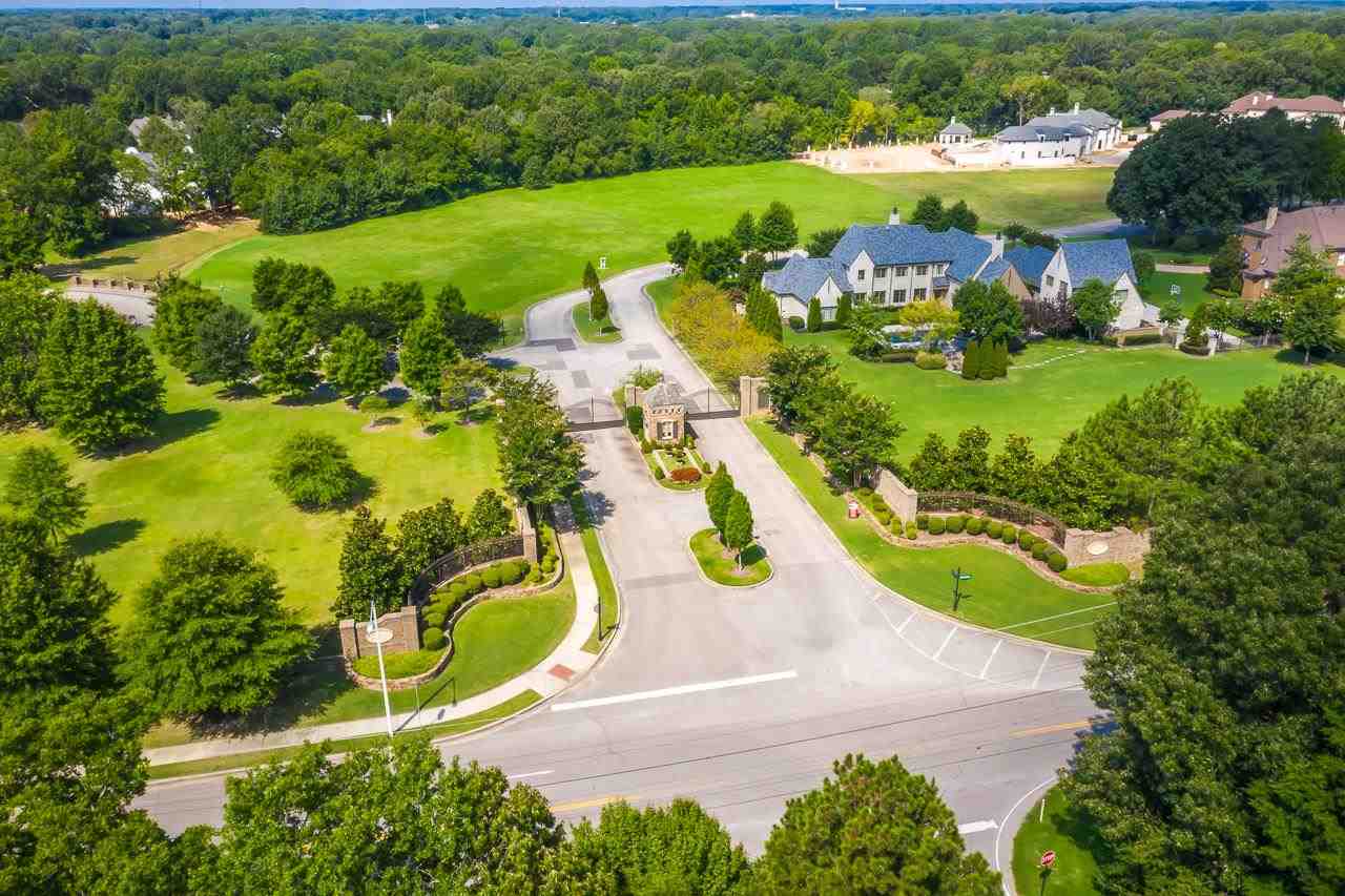 a view of a lake with a yard