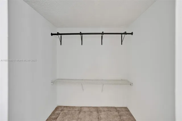 a bathroom with a sink vanity and mirror