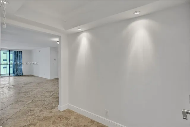 a kitchen that has a sink a stove and cabinets