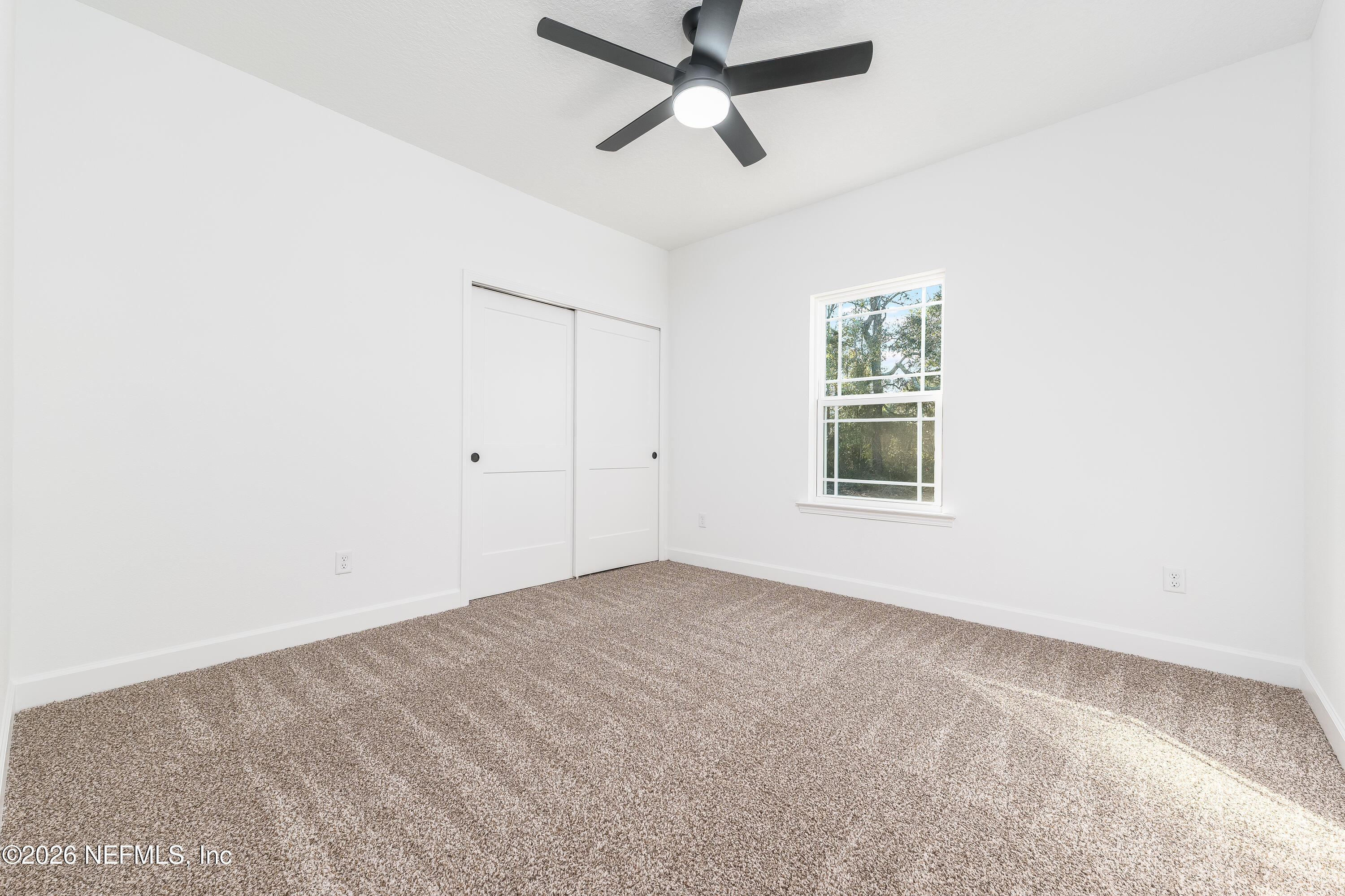 5687 Cibola Street Keystone Heights, FL 32656 - Photo 15 of 21 an empty room with a window and a fan