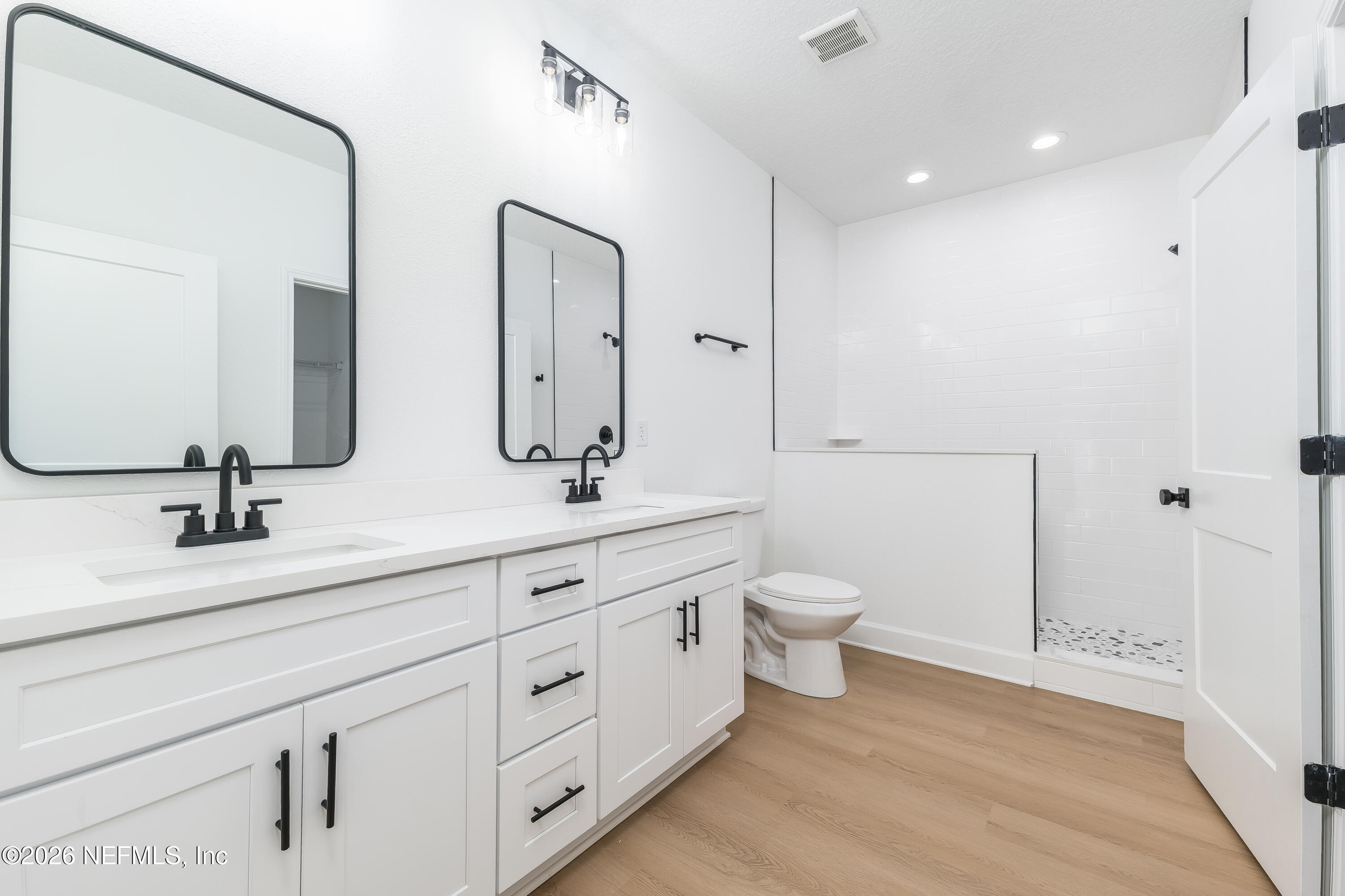 5687 Cibola Street Keystone Heights, FL 32656 - Photo 10 of 21 a bathroom with a double vanity sink double and mirror