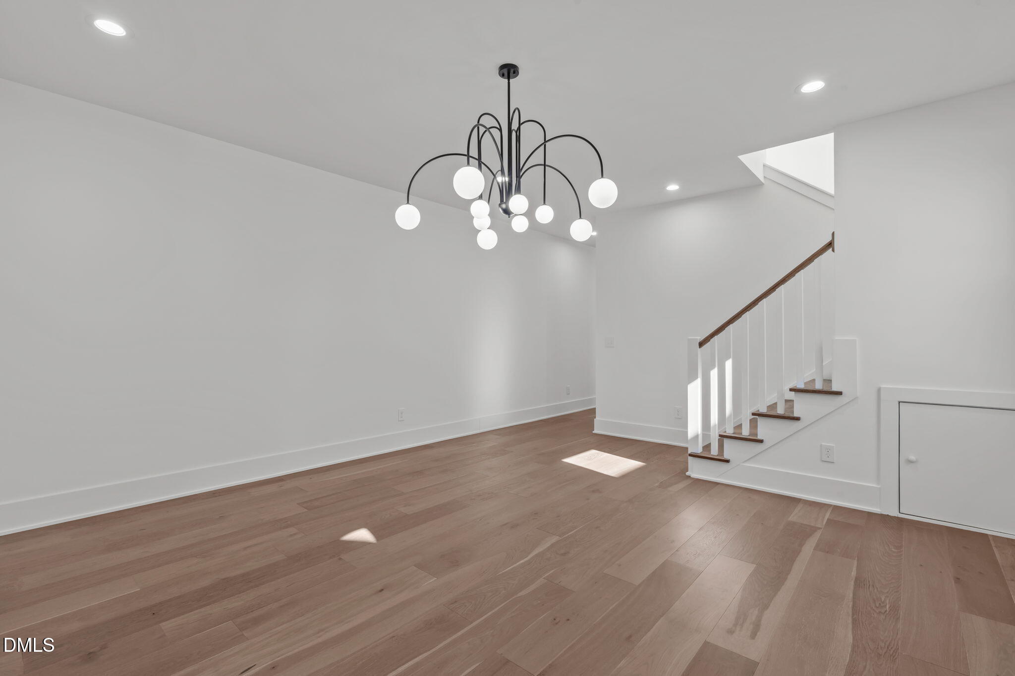 637 Conover Road, Unit B Durham, NC 27703 - Photo 10 of 52 a view of an empty room with wooden floor