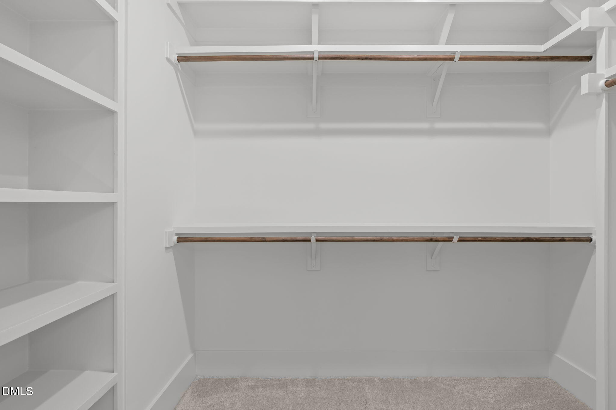 637 Conover Road, Unit B Durham, NC 27703 - Photo 31 of 52 a view of walk in closet with empty racks