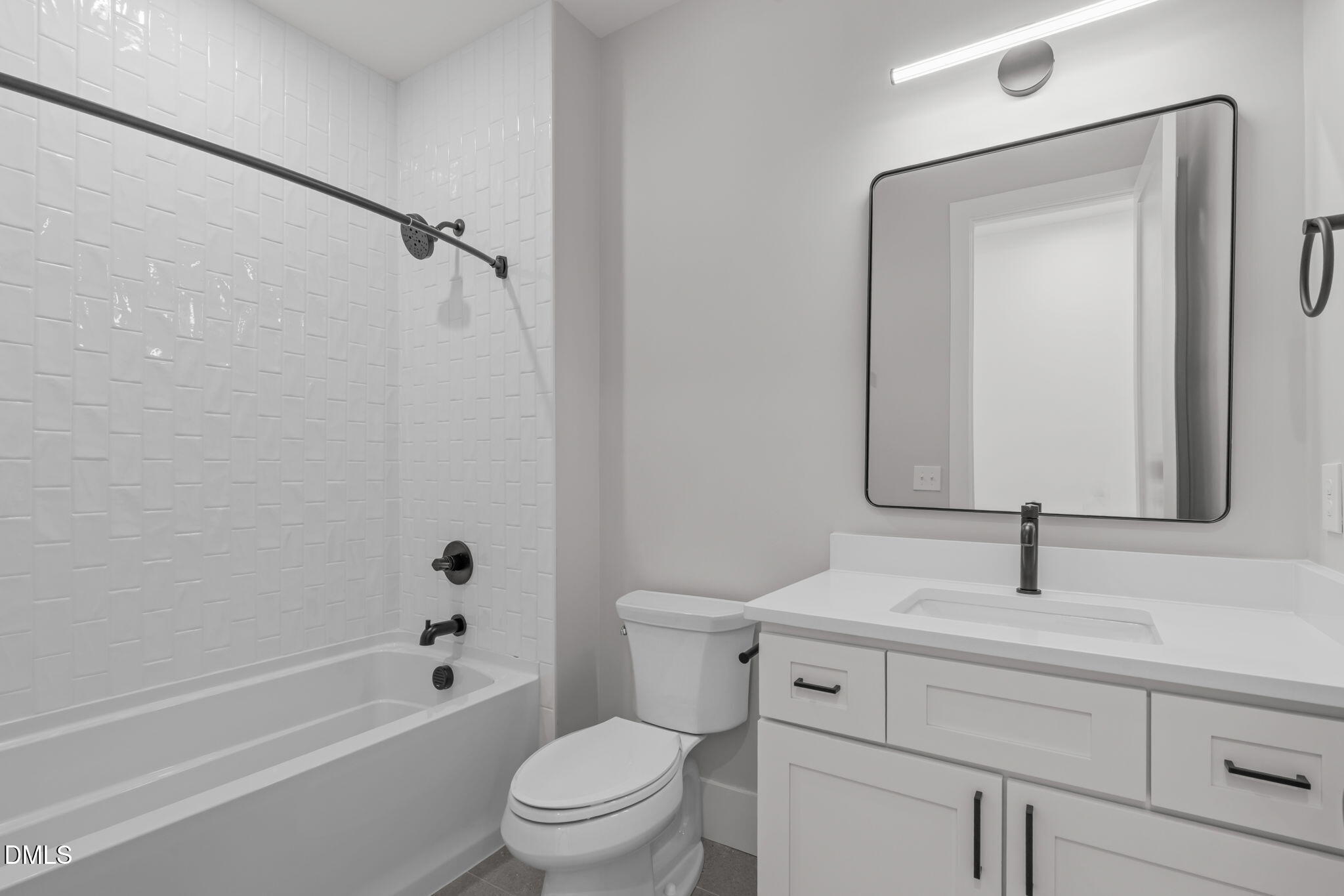 637 Conover Road, Unit B Durham, NC 27703 - Photo 34 of 52 a bathroom with a sink toilet and shower