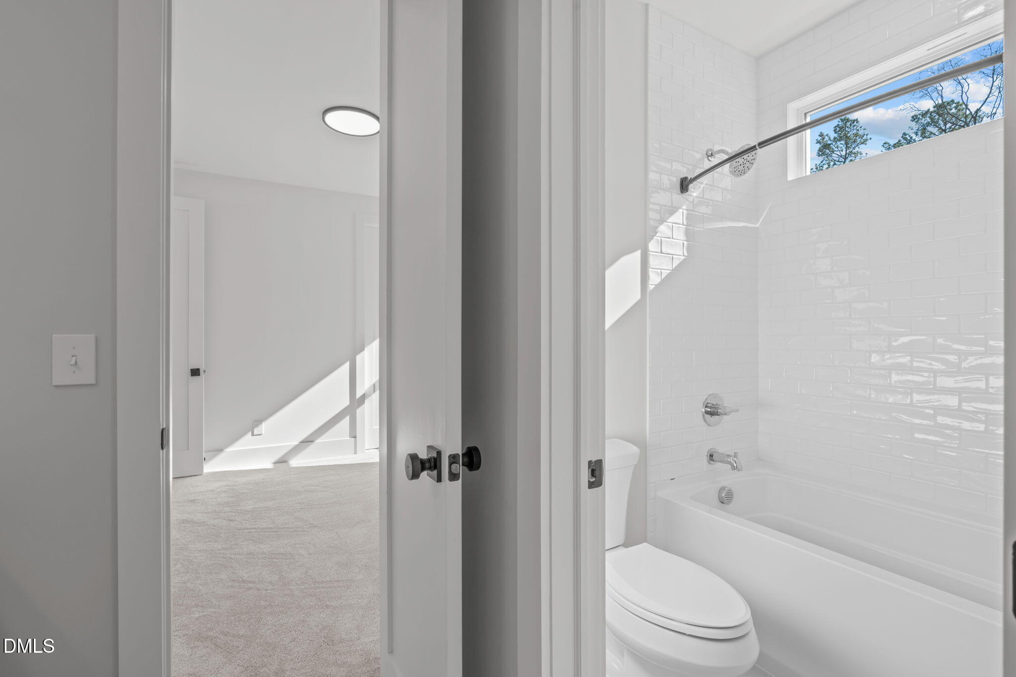 637 Conover Road, Unit B Durham, NC 27703 - Photo 39 of 52 a bathroom with a granite countertop bathtub shower sink vanity and toilet