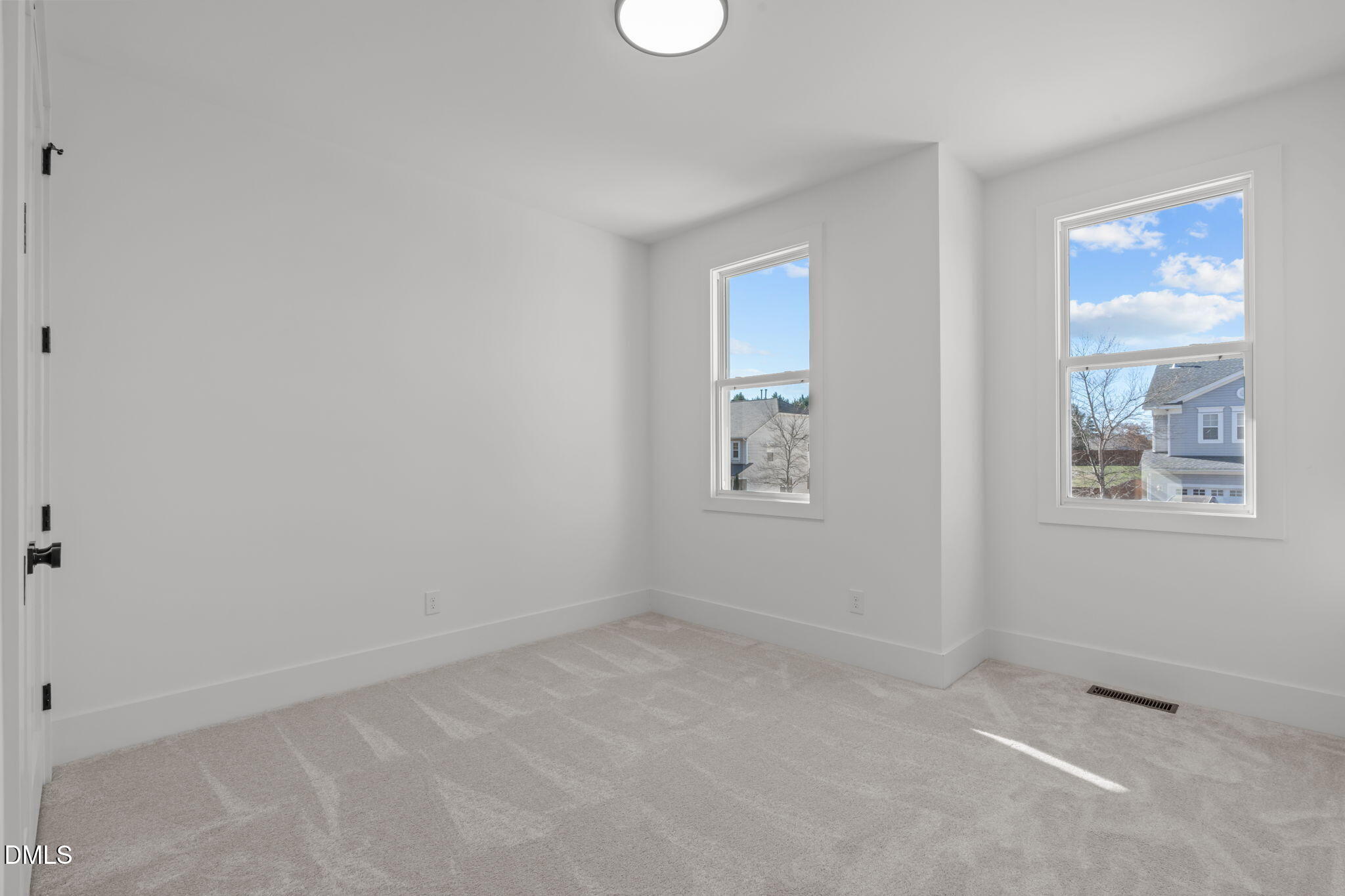 637 Conover Road, Unit B Durham, NC 27703 - Photo 40 of 52 an empty room with windows