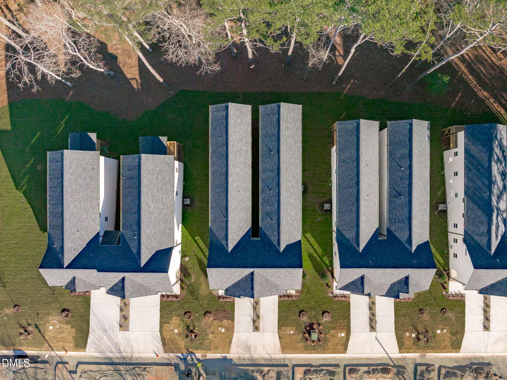 637 Conover Road, Unit B Durham, NC 27703 - Photo 50 of 52 a front view of multi story residential apartment building with yard and outdoor seating