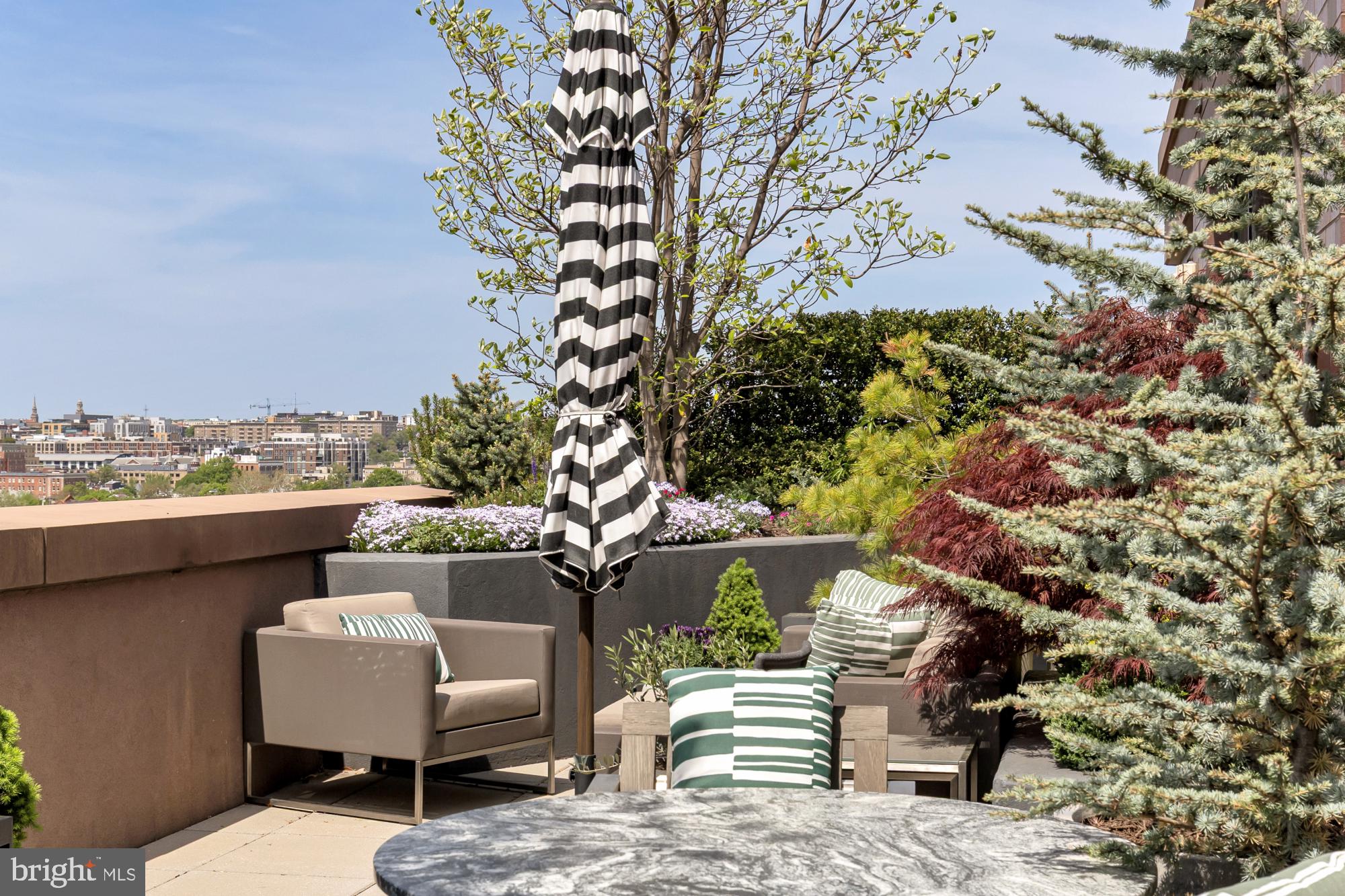810 O Street Northwest, Unit 901 Washington, DC 20001 - Photo 21 of 38 a view of a chairs and table in a terrace