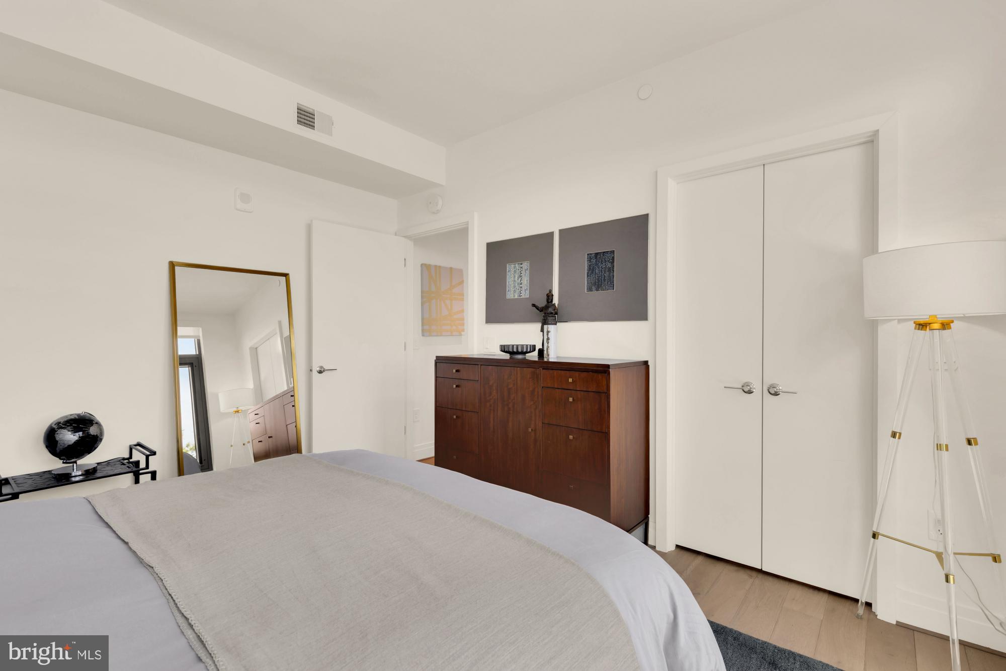 810 O Street Northwest, Unit 901 Washington, DC 20001 - Photo 23 of 38 a bedroom with a bed and a dresser