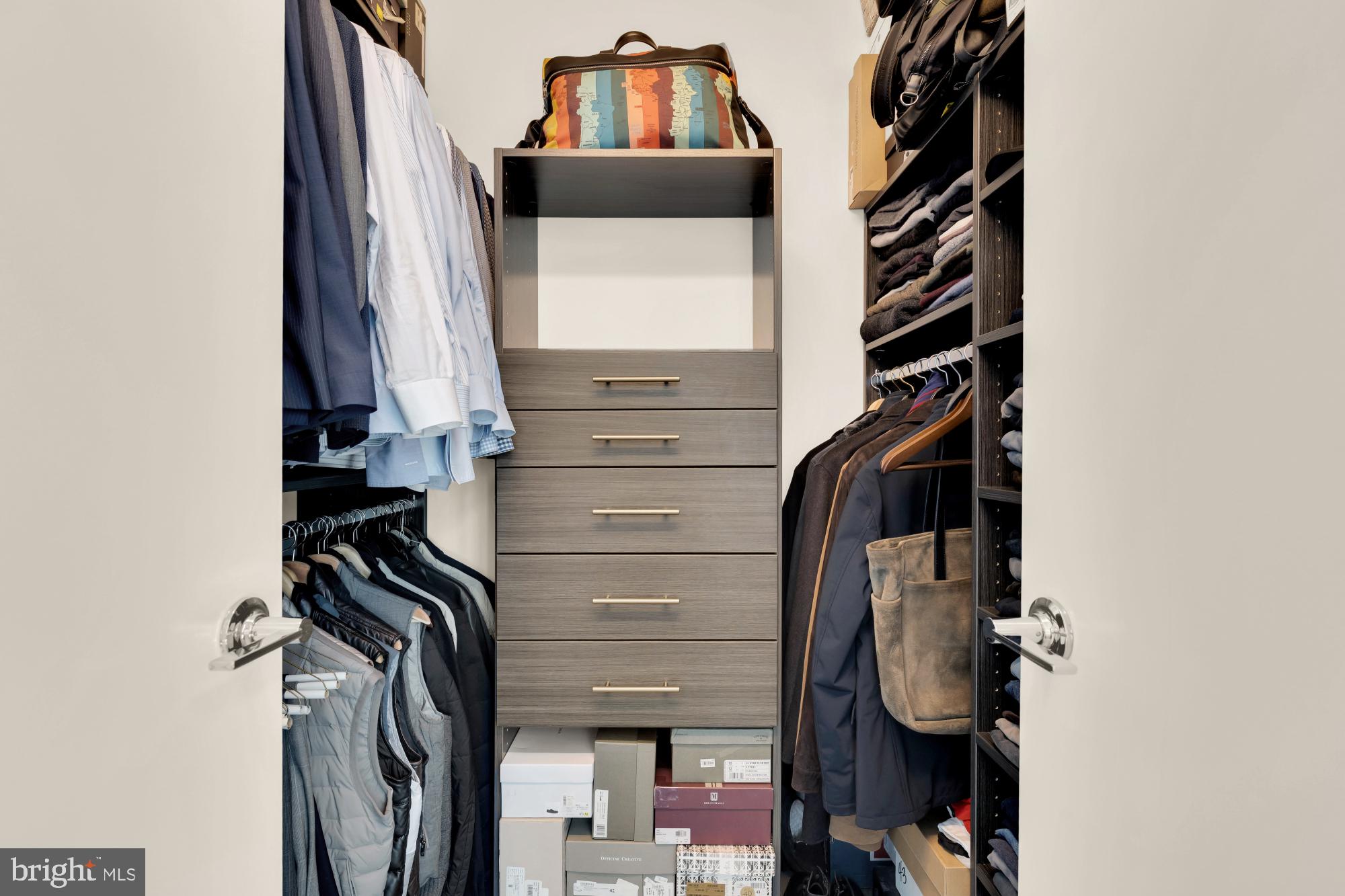 810 O Street Northwest, Unit 901 Washington, DC 20001 - Photo 27 of 38 a view of walk in closet with clothes and shoes