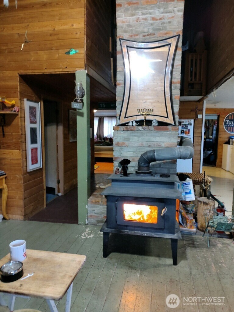 57 Slippery Hill Lane Republic, WA 99166 - Photo 11 of 32 a kitchen with a stove and a microwave