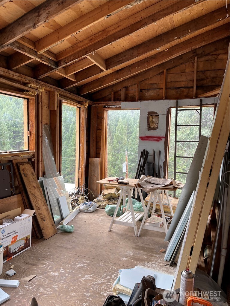 57 Slippery Hill Lane Republic, WA 99166 - Photo 21 of 32 a room with gym equipment and large windows