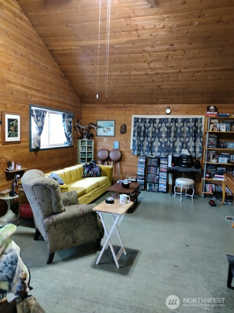 57 Slippery Hill Lane Republic, WA 99166 - Photo 8 of 32 a living room with furniture and a rug