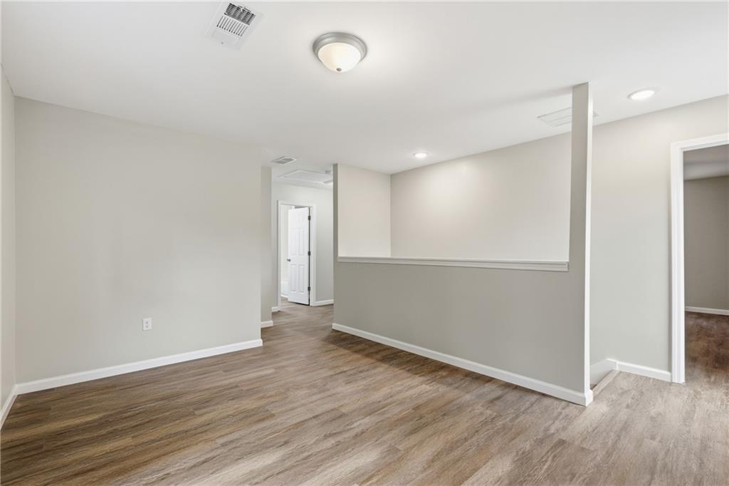 151 Richardson Street Toccoa, GA 30577 - Photo 23 of 48 an empty room with wooden floor