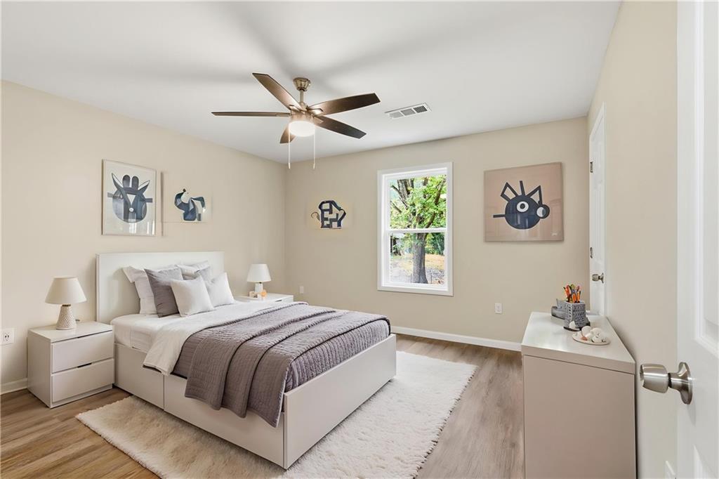151 Richardson Street Toccoa, GA 30577 - Photo 24 of 48 a bedroom with a bed and a window