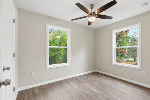 a view of a yard with trees