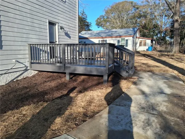 an aerial view of residential houses with outdoor space and street view