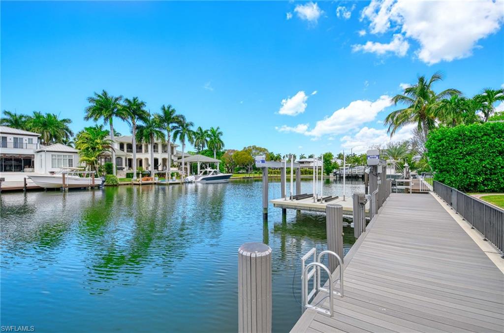 1888 6th Street South Naples, FL 34102 - Photo 18 of 37 a view of a lake with houses
