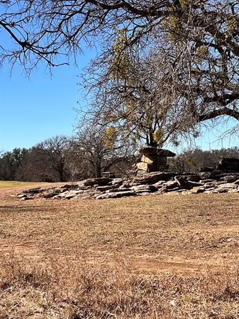 a view of a yard covered with snow in front of house