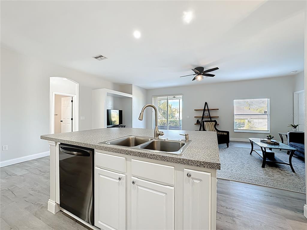 312 Towhee Road Winter Haven, FL 33881 - Photo 11 of 45 a kitchen with sink and mirror