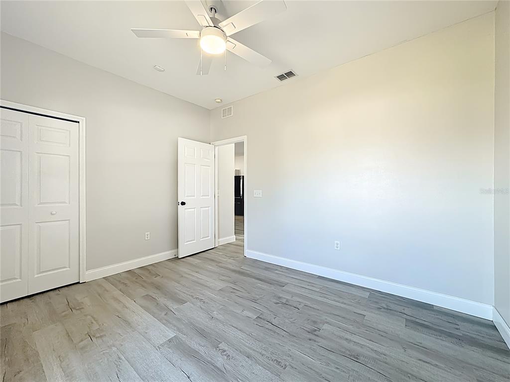 312 Towhee Road Winter Haven, FL 33881 - Photo 31 of 45 a view of an empty room with wooden floor