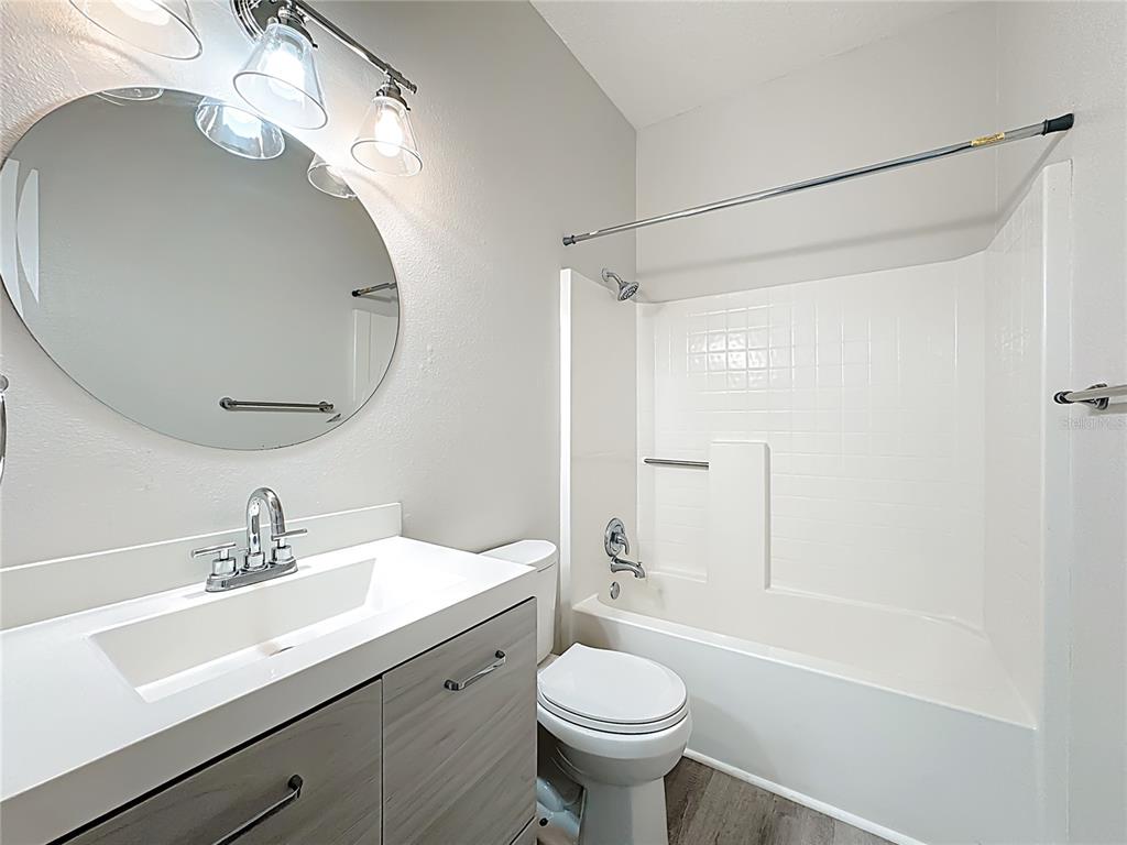 312 Towhee Road Winter Haven, FL 33881 - Photo 36 of 45 a bathroom with a sink toilet a mirror and shower