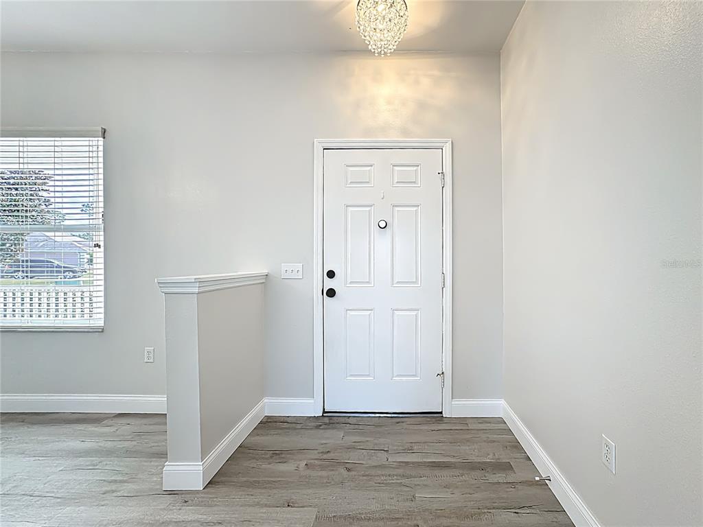 312 Towhee Road Winter Haven, FL 33881 - Photo 45 of 45 an empty room with wooden floor closet and windows