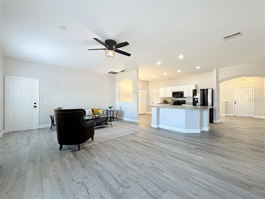 312 Towhee Road Winter Haven, FL 33881 - Photo 6 of 45 a view of kitchen with cabinets and wooden floor